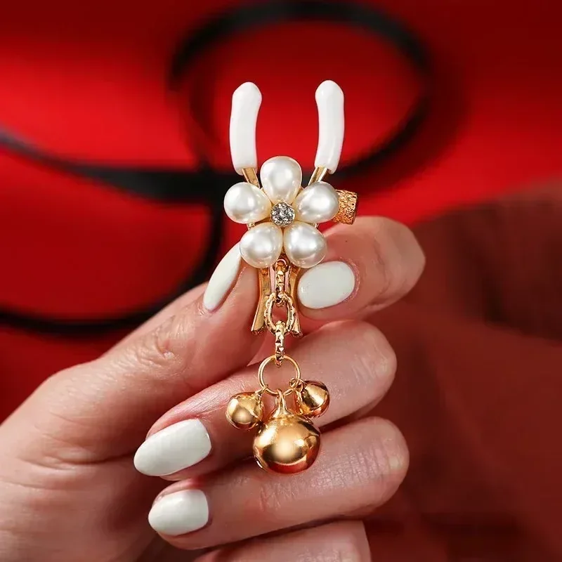pince a seins lestee avec decoration perle